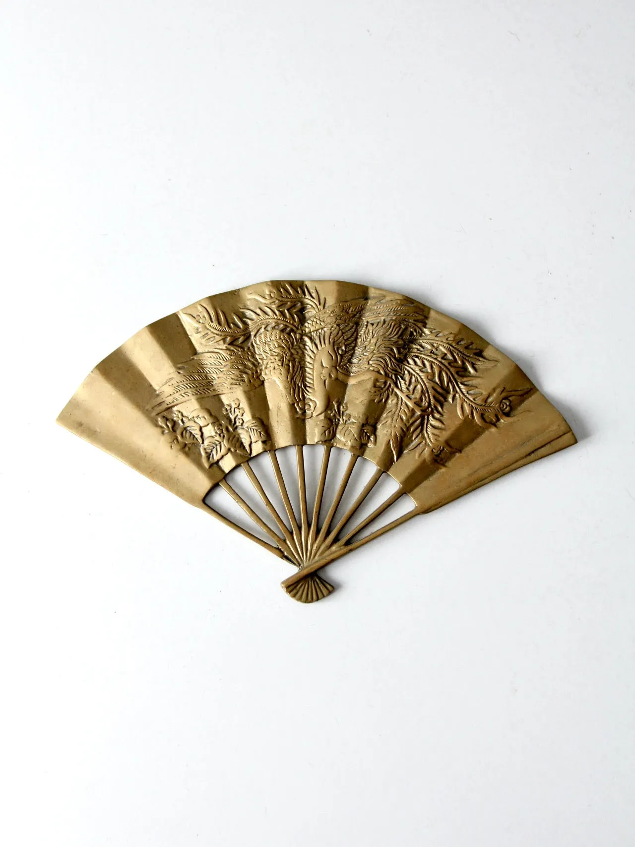 mid-century figurative brass fan wall hanging