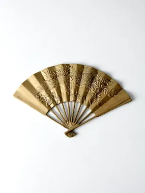 mid-century figurative brass fan wall hanging